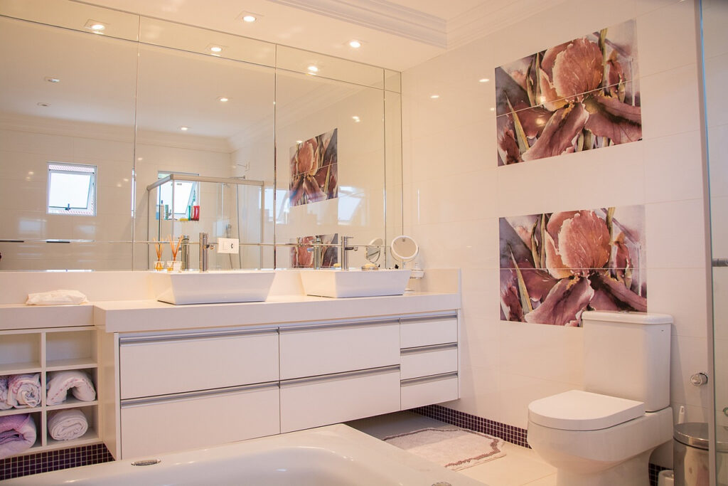 Modern bathroom renovation with upgrades and white color everywhere.